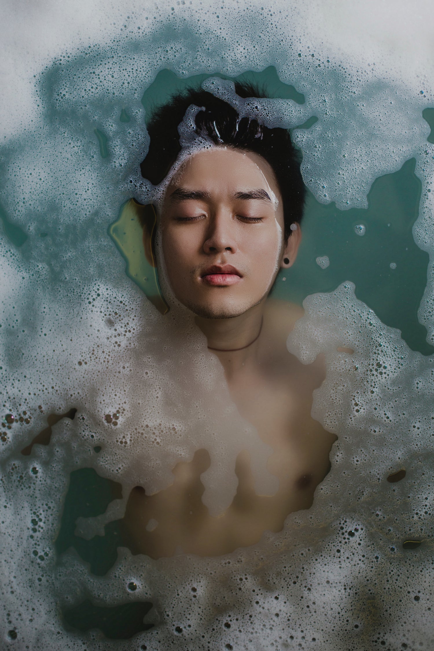 Person enjoying a relaxing bath